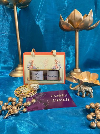 A small and sweet Diwali gesture. This mini carrier box holds two jars of dry fruits or chocolates, making it a perfect token of love for friends and colleagues.