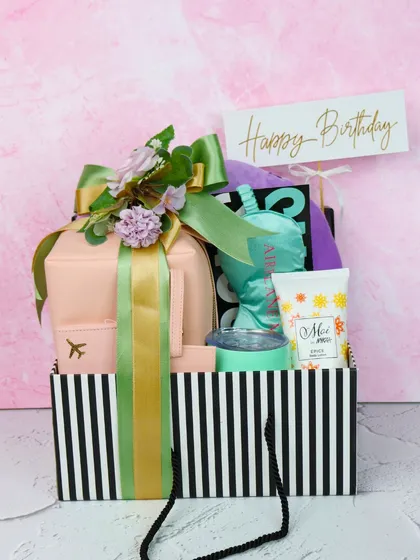 The ultimate birthday hamper for someone special. This gift bag is packed with personalized travel essentials, pampering treats, and other goodies to make their day even brighter.