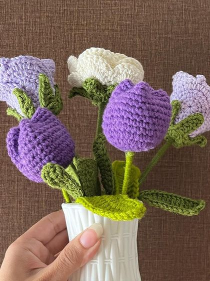 Lilac love in a vase. This simple arrangement of purple and white crochet tulips and bellflowers adds a touch of handmade elegance to your home.