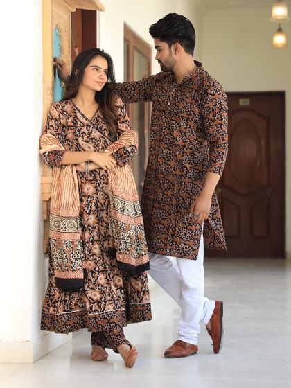 A romantic pose in our black and beige floral printed couple's attire. The pure cotton fabric ensures you both stay comfortable throughout your event.