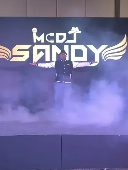 Making a statement with a custom branded stage for a corporate dealers meet. This setup includes a high-resolution LED screen for my logo and visuals, professional speakers, and smoke effects to create a dramatic entrance and a high-impact party atmosphere.