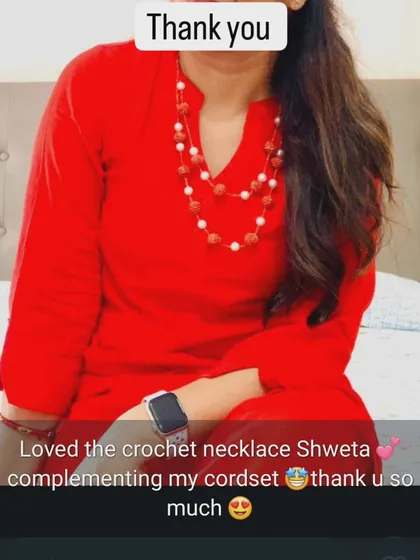 A happy customer shared this photo, loving how my crochet necklace complemented her red cord set. Thank you for showcasing my creation so elegantly.