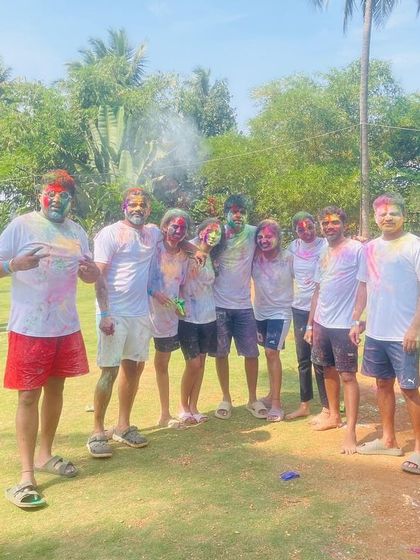 Happy Holi. A group of friends celebrates the festival of colors with us, covered in vibrant powders and big smiles.