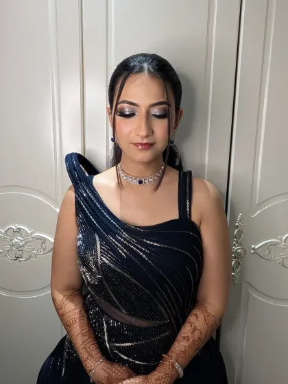 A close-up of the cocktail glam. The silver-toned eyeshadow and perfectly blended skin create a look that is both modern and timelessly beautiful.