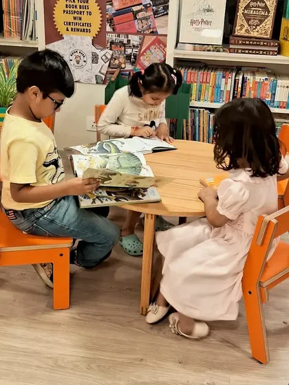 Our little readers making the most of their summer, lost in the world of words and colors. The kids' corner is their special space to explore.