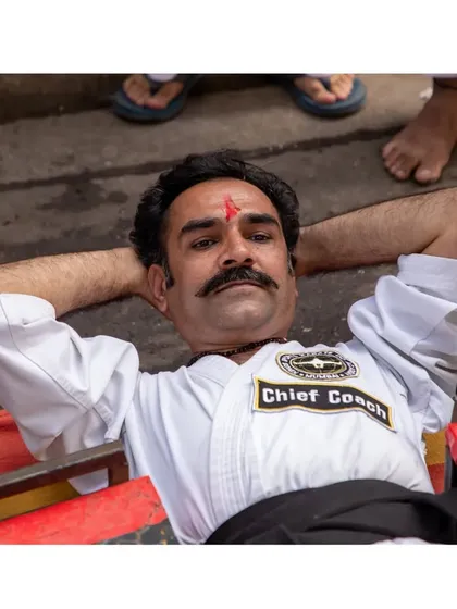A moment of rest and composure during the car stunt record. Even in the most intense situations, maintaining a calm mind is crucial for success.