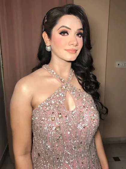 A close-up of the engagement diva, showing the intricate details of the eye makeup and the radiant skin.