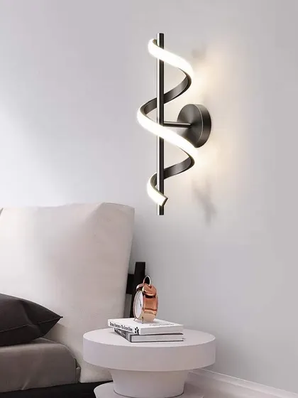A spiral LED wall sconce. The twisting design creates a dynamic and modern look, perfect for a hallway or bedroom.