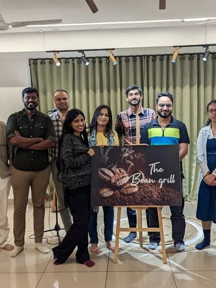 The community that creates together. A group photo after a fantastic "The Bean Grill" open mic, celebrating a night of wonderful performances and new friendships.