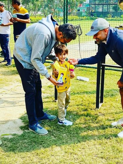 It's a proud moment for our youngest players to be recognized for their efforts. Here, a TUG Cub receives his prize, feeling like a true champion.