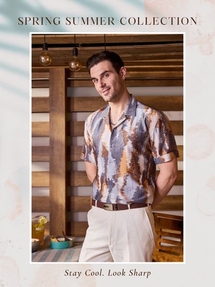 Another view of the brown printed shirt, showcasing its versatile color palette that pairs well with light-colored trousers.