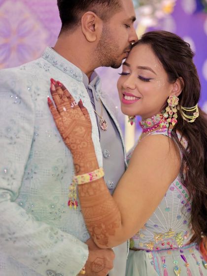 Unicorn eyes for this fun pre-wedding event. The makeup is playful and glamorous, with pastel shimmers on the eyes to match her unique outfit.