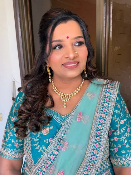A candid shot capturing her natural beauty and the elegance of the makeover.