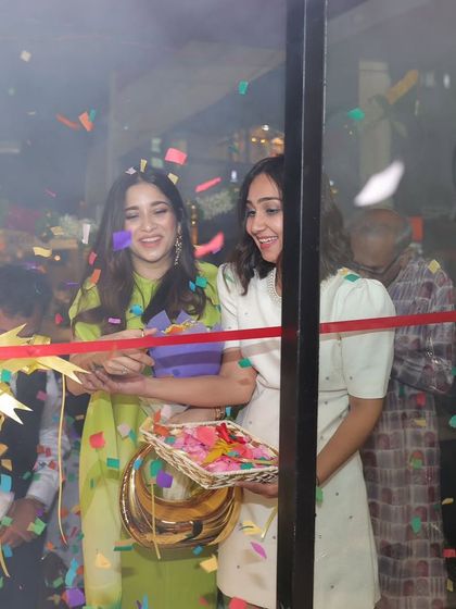 The official ribbon-cutting moment. So much joy and excitement in the air, celebrating a new chapter for a passionate and talented designer.