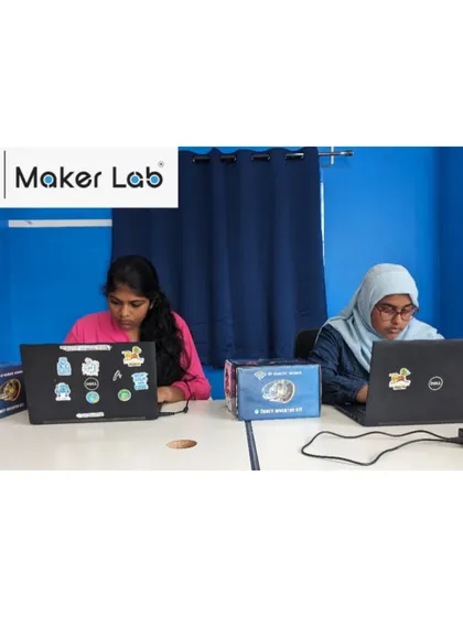 We believe in creating an inclusive environment where every student can thrive. Here, two of our students are focused on their coding tasks, demonstrating the concentration and dedication we see in our young innovators every day.