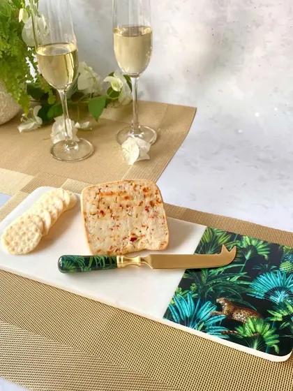 Our Amazonia cheese board brings the wild beauty of the tropics to your table. The cool, smooth marble is the perfect canvas for a vivid print, creating a piece that is both a functional cheese platter and a work of art.