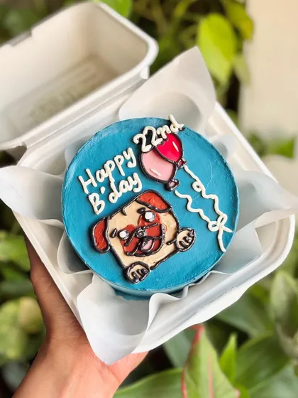 Celebrating with a pug-load of cuteness! This bento cake features an adorable pug illustration with a birthday balloon, perfect for dog lovers.
