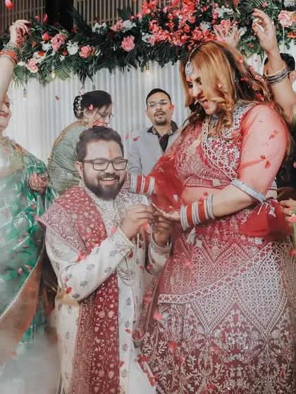 Another angle of the dramatic ring exchange, capturing the excitement from the guests' perspective.