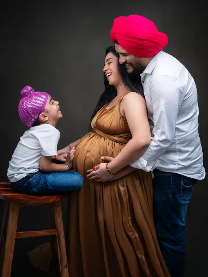 There is a special kind of joy in a family that is waiting to welcome a new life. In this studio maternity session, I focused on the natural interactions and laughter between the parents and their son. The warmth in their expressions tells a beautiful story of love and anticipation.