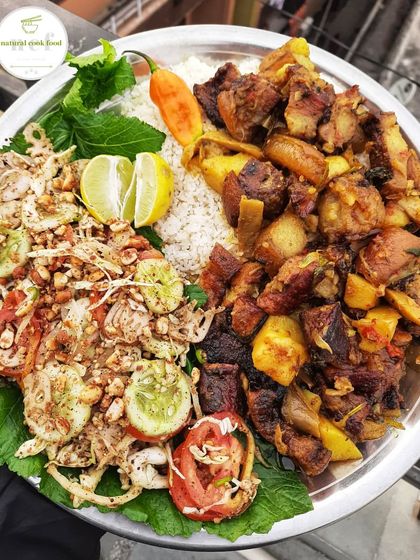 A beautiful platter of smoked pork served with a fresh, crunchy salad. The richness of the pork is perfectly balanced by the zesty salad.