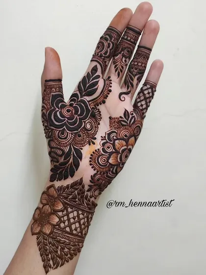 The complete floral design, with a beautiful wrist cuff and detailed fingers. I love how all the elements come together in this piece.