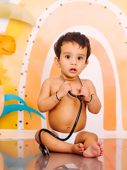 Future doctor in the house. Using simple props like a stethoscope can add a fun, imaginative twist to any baby photoshoot.