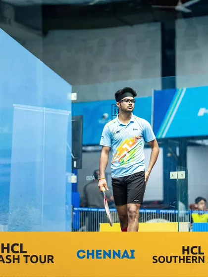 A moment of focus between rallies at the HCL Southern Slam. Mental strength is just as important as physical skill.